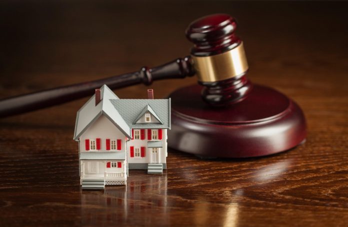How Real Estate Law Addresses Property Encumbrances and Liens